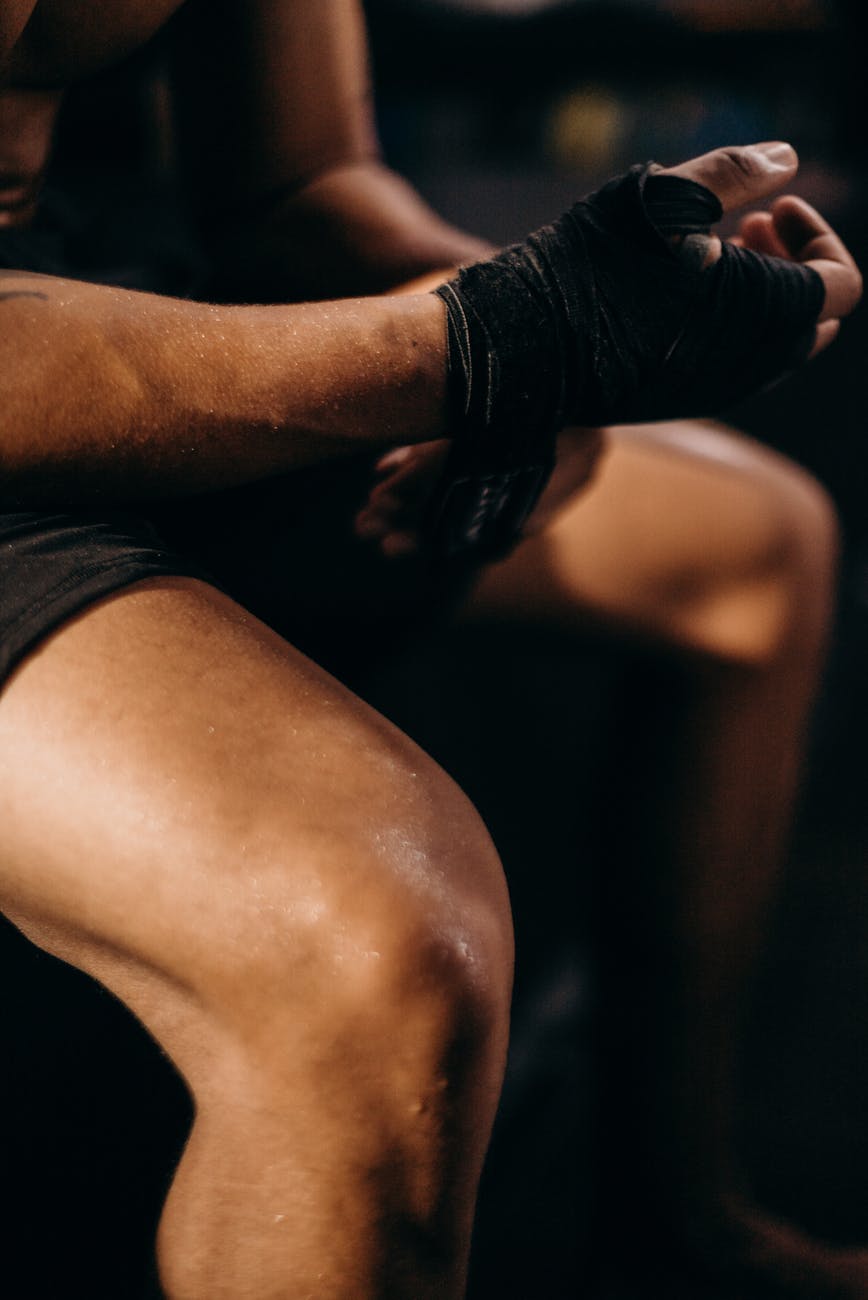 woman in black leather gloves and black shorts